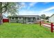 Charming single-story home with a well-manicured lawn and a quaint covered front porch at 126 Brunswick Dr, Greenwood, IN 46143