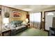Inviting living room showcases comfortable seating and natural light from the window at 126 Brunswick Dr, Greenwood, IN 46143