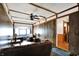 Living room with wood paneling, ceiling fan and comfortable seating at 126 Brunswick Dr, Greenwood, IN 46143