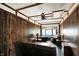 Living room with wood paneling, ceiling fan and comfortable seating area at 126 Brunswick Dr, Greenwood, IN 46143