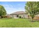 Well-maintained backyard with a pergola, patio, and manicured lawn at 131 Stamford Dr, Pittsboro, IN 46167