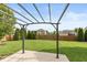 Backyard featuring a concrete patio with pergola, lawn, fence, and landscaping at 131 Stamford Dr, Pittsboro, IN 46167