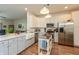 Bright and spacious kitchen featuring stainless steel appliances, white cabinets, and a center island at 131 Stamford Dr, Pittsboro, IN 46167