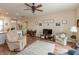 Bright and airy living room with comfortable seating, wood floors, and decor at 131 Stamford Dr, Pittsboro, IN 46167