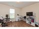 Bright home office area featuring computer desk and ample storage shelving at 131 Stamford Dr, Pittsboro, IN 46167
