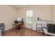 Home office area with wood floors, a window for light, and a computer desk at 131 Stamford Dr, Pittsboro, IN 46167