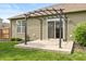 Covered patio area featuring a metal pergola frame and sliding glass door access at 131 Stamford Dr, Pittsboro, IN 46167