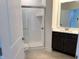 Bathroom featuring a glass enclosed shower, vanity with dark cabinets and white countertop at 14913 Higgins Dr, Westfield, IN 46074