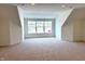 Spacious carpeted room with natural light from a large window at 14913 Higgins Dr, Westfield, IN 46074