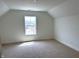 Carpeted bedroom with a window offering a view of the outdoors at 14913 Higgins Dr, Westfield, IN 46074