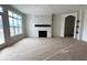 Bright living room features large windows, a stone fireplace, and an open layout at 14913 Higgins Dr, Westfield, IN 46074