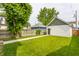 Well maintained backyard with lush grass and detached garage at 1534 Fletcher Ave, Indianapolis, IN 46203
