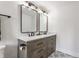 Contemporary bathroom featuring double vanity with quartz countertop and unique patterned tile floor at 1534 Fletcher Ave, Indianapolis, IN 46203