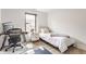Cozy bedroom with a bed, desk area, and light filled window at 1534 Fletcher Ave, Indianapolis, IN 46203