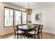 A dining area featuring lots of natural light and seating for six at 1534 Fletcher Ave, Indianapolis, IN 46203