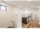 Bright hallway with wood floors, stylish rug, and natural light at 1534 Fletcher Ave, Indianapolis, IN 46203
