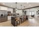 A kitchen featuring white cabinets, stainless steel appliances, and an island with seating at 1534 Fletcher Ave, Indianapolis, IN 46203