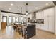 Modern kitchen with island seating, stainless steel appliances, and stylish white cabinets at 1534 Fletcher Ave, Indianapolis, IN 46203
