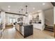 Kitchen boasting an island with seating, stainless steel appliances, and hardwood floors at 1534 Fletcher Ave, Indianapolis, IN 46203