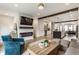 Open-concept living room flowing into kitchen, featuring modern fireplace and comfortable seating at 1534 Fletcher Ave, Indianapolis, IN 46203