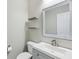 Well-lit bathroom with a modern vanity and decorative mirror at 16112 Lavina Ln, Fishers, IN 46040