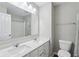 Modern bathroom featuring a double sink vanity, large mirror, and shower-tub combo for convenience at 16112 Lavina Ln, Fishers, IN 46040
