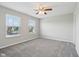 Well-lit bedroom with dual windows and neutral carpeting, offering a serene living space at 16112 Lavina Ln, Fishers, IN 46040