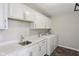 Laundry room featuring cabinetry for storage and a convenient countertop space and sink at 16112 Lavina Ln, Fishers, IN 46040