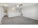 Spacious loft area with neutral tones, ceiling fan, and open layout perfect for entertaining or relaxing at 16112 Lavina Ln, Fishers, IN 46040
