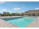 Community pool with crystal clear water and nearby community building and landscaping at 16112 Lavina Ln, Fishers, IN 46040
