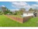 Fenced backyard with green grass, above ground pool, and space for outdoor activities at 1633 E Thompson Rd, Indianapolis, IN 46227