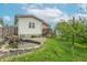 Landscaped backyard featuring a charming pond with a small waterfall feature surrounded by lush greenery at 1633 E Thompson Rd, Indianapolis, IN 46227