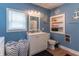 Clean, updated bathroom with vanity, toilet, and organized storage at 1633 E Thompson Rd, Indianapolis, IN 46227