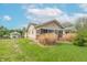 Charming home with a large sunroom, detached garage, and a well-maintained lawn at 1633 E Thompson Rd, Indianapolis, IN 46227