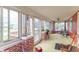 Bright sunroom with many windows, a ceiling fan, and space for seating and dining at 1633 E Thompson Rd, Indianapolis, IN 46227