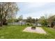 A view of the backyard that overlooks a pond with a fountain feature at 177 Tracy Ridge Blvd, Whiteland, IN 46184