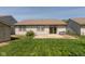 An attractive backyard featuring a well-maintained lawn, a patio and a grill at 177 Tracy Ridge Blvd, Whiteland, IN 46184