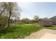 A view of the backyard with a storage shed and an area for a fire pit at 177 Tracy Ridge Blvd, Whiteland, IN 46184