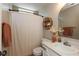 Bathroom with a white vanity, toilet, and shower with tasseled curtain at 177 Tracy Ridge Blvd, Whiteland, IN 46184