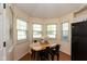 Cozy dining area with natural light streaming in from windows around the perimeter at 177 Tracy Ridge Blvd, Whiteland, IN 46184