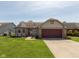 Traditional single-story home with brick accents, attached garage, and a well-maintained front lawn at 177 Tracy Ridge Blvd, Whiteland, IN 46184