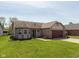 Charming single-story home with well-manicured lawn and attached two-car garage at 177 Tracy Ridge Blvd, Whiteland, IN 46184
