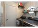 This laundry room includes shelving and a modern washer and dryer for your convenience at 177 Tracy Ridge Blvd, Whiteland, IN 46184