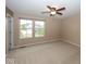 Bedroom with natural light, ceiling fan, and neutral-toned carpet at 2006 Creek Bank Dr, Columbus, IN 47201