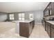 Modern kitchen with stainless steel appliances, granite countertops, and center island with sink at 2006 Creek Bank Dr, Columbus, IN 47201