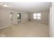 Large living room featuring neutral walls and carpet and an abundance of natural light at 2006 Creek Bank Dr, Columbus, IN 47201