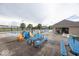Poolside with picnic tables, colorful chairs and plenty of room for community members to gather and enjoy themselves at 2006 Creek Bank Dr, Columbus, IN 47201