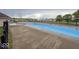 Community pool with lounge chairs for relaxing and enjoying the sunshine at 2006 Creek Bank Dr, Columbus, IN 47201