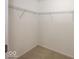 Empty walk-in closet with metal shelves at 2006 Creek Bank Dr, Columbus, IN 47201