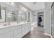 Spacious bathroom features double sinks, a shower with glass doors, and ample counter space, and closet at 2261 Shadow Trace Way, Greenwood, IN 46143